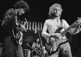 Eric Bell (right) performs onstage with Thin Lizzy