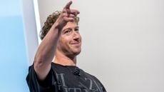  Mark Zuckerberg in a black shirt, pointing