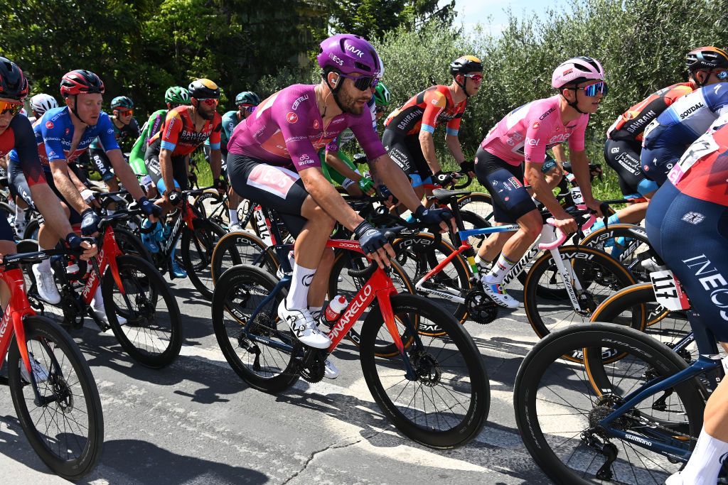 SAN SALVO ITALY MAY 07 LR Tao Geoghegan Hart of The United Kingdom and Team INEOS Grenadiers Blue Mountain Jersey Filippo Ganna of Italy and Team INEOS Grenadiers Purple Points Jersey and Remco Evenepoel of Belgium and Team Soudal Quick Step Pink Leader Jersey compete during the 106th Giro dItalia 2023 Stage 2 a 202km stage from Teramo to San Salvo UCIWT on May 07 2023 in San Salvo Italy Photo by Tim de WaeleGetty Images