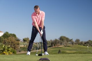 Note the position of the hands at impact with the driver and iron