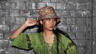 Nova Onas attends the BEC + BRIDGE show wearing a bucket hat during Afterpay Australian Fashion Week 2022 Resort '23 Collections at Carriageworks on May 09, 2022 in Sydney, Australia.
