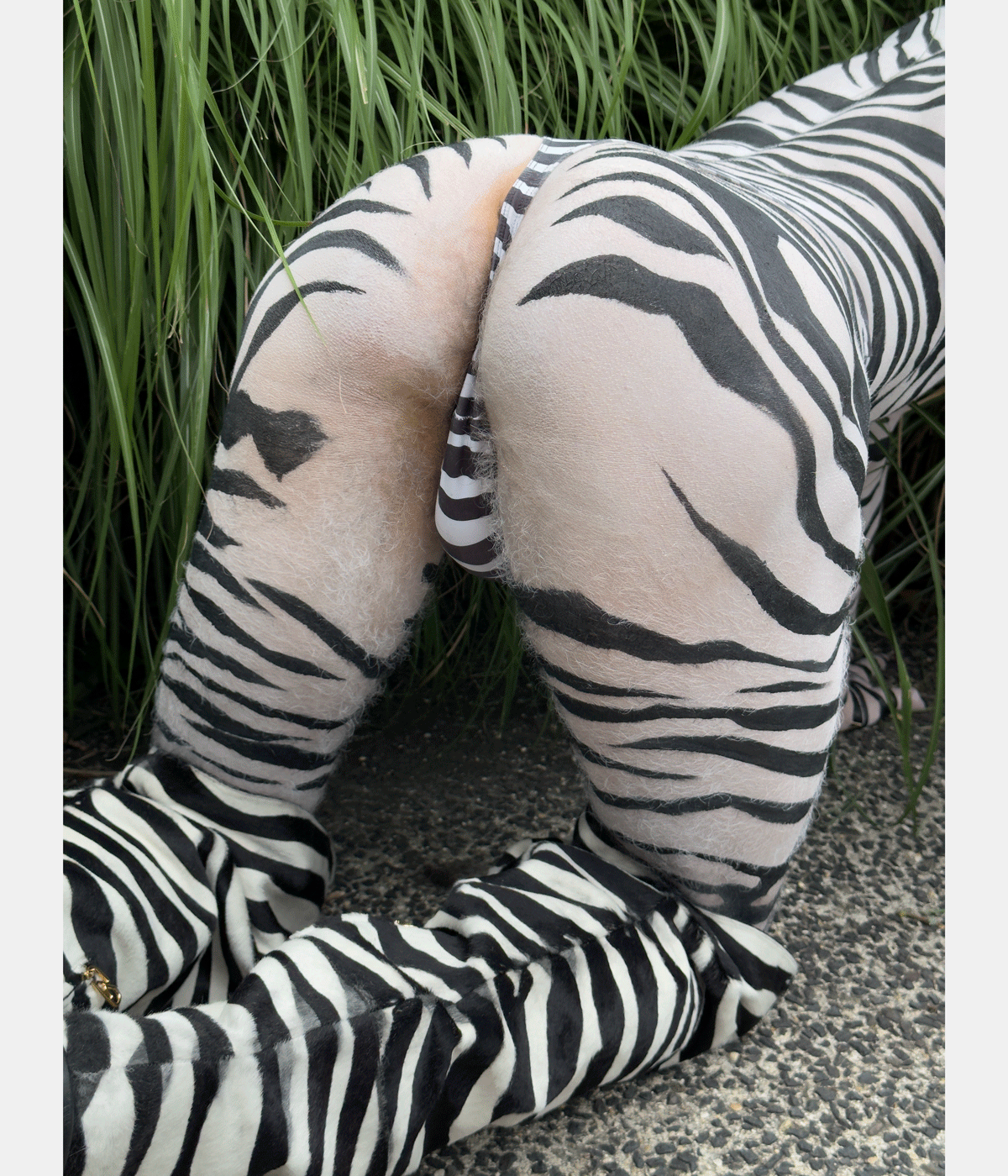 Juergen Teller photograph of person&#039;s rear, painted like a zebra