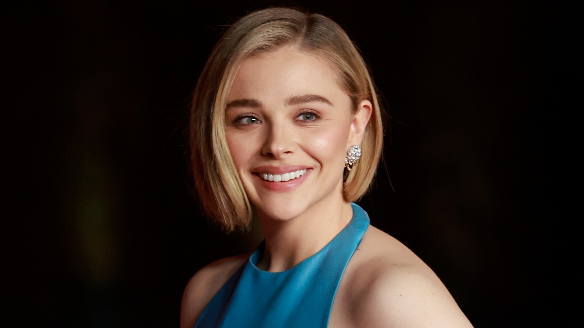 a woman with short blond hair