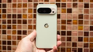 Google Pixel 10 Pro in Jade with checkered tile backsplash background