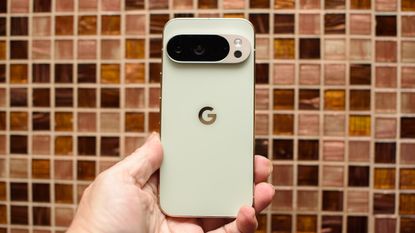 Google Pixel 10 Pro in Jade with checkered tile backsplash background