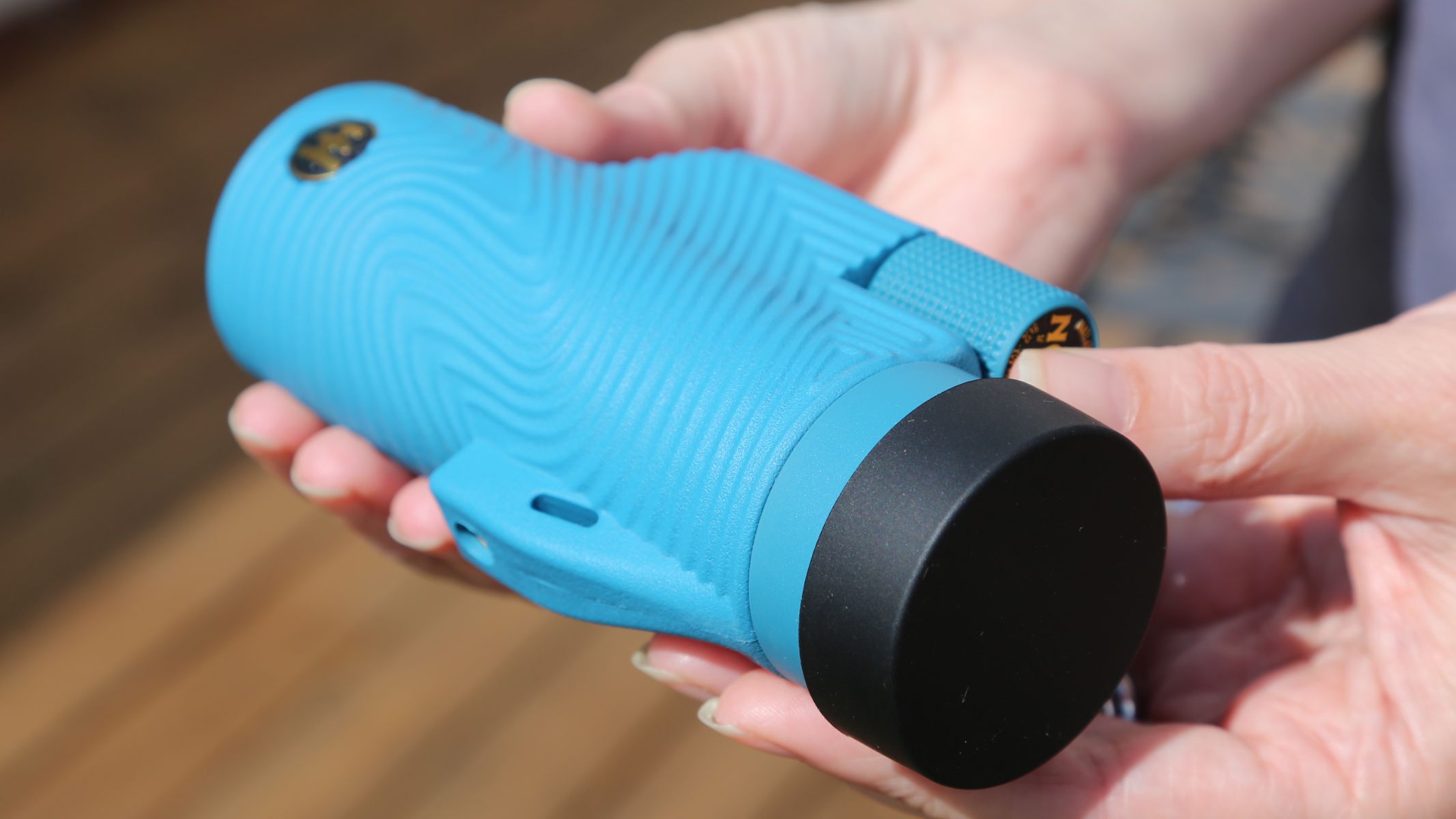 A blue Nocs Provisions 8X32 Field Tube monocular review in the author's hand.