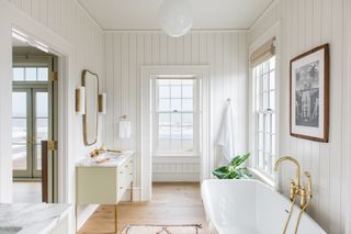 a white shiplap bathroom