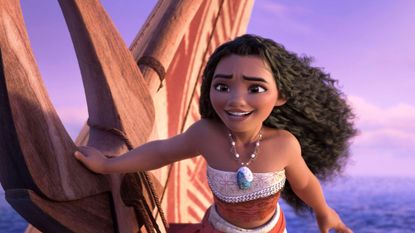 Moana's hair blows in the wind as she sails aboard a ship