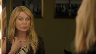 Ellen Pompeo as Kristine looking in the mirror in Good American Family