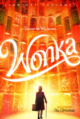 Willy Wonka looks up at a wall of candy in the Wonka teaser poster.