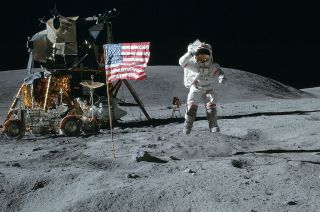 Apollo 16 commander John Young jumps and salutes the American flag while on the moon in April 1972.