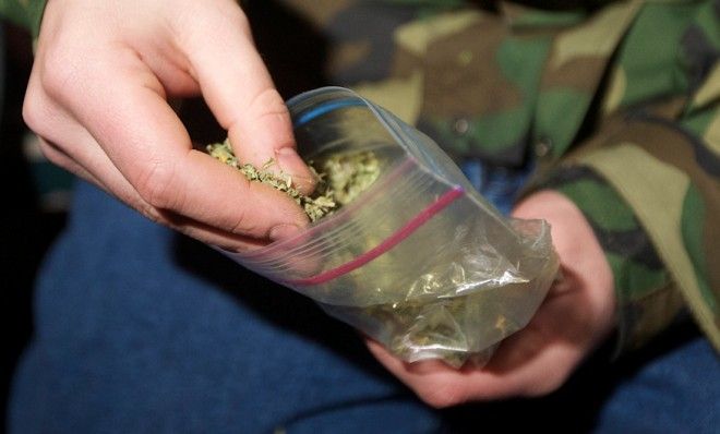 A Seattle resident prepares to smoke marijuana shortly after it became legal in the state on Dec. 6, 2012.