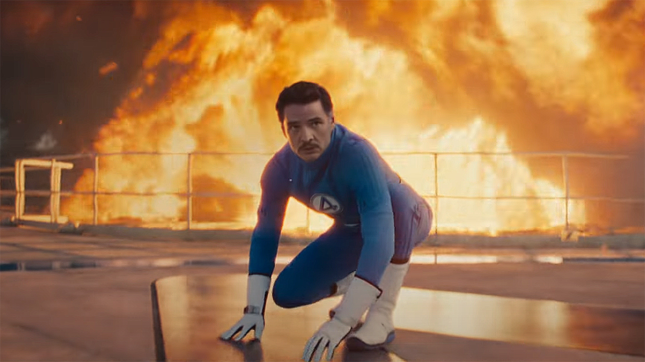 Pedro Pascal&#039;s Reed Richards in a superhero pose with an explosion going off in the background in The Fantastic Four: First Steps