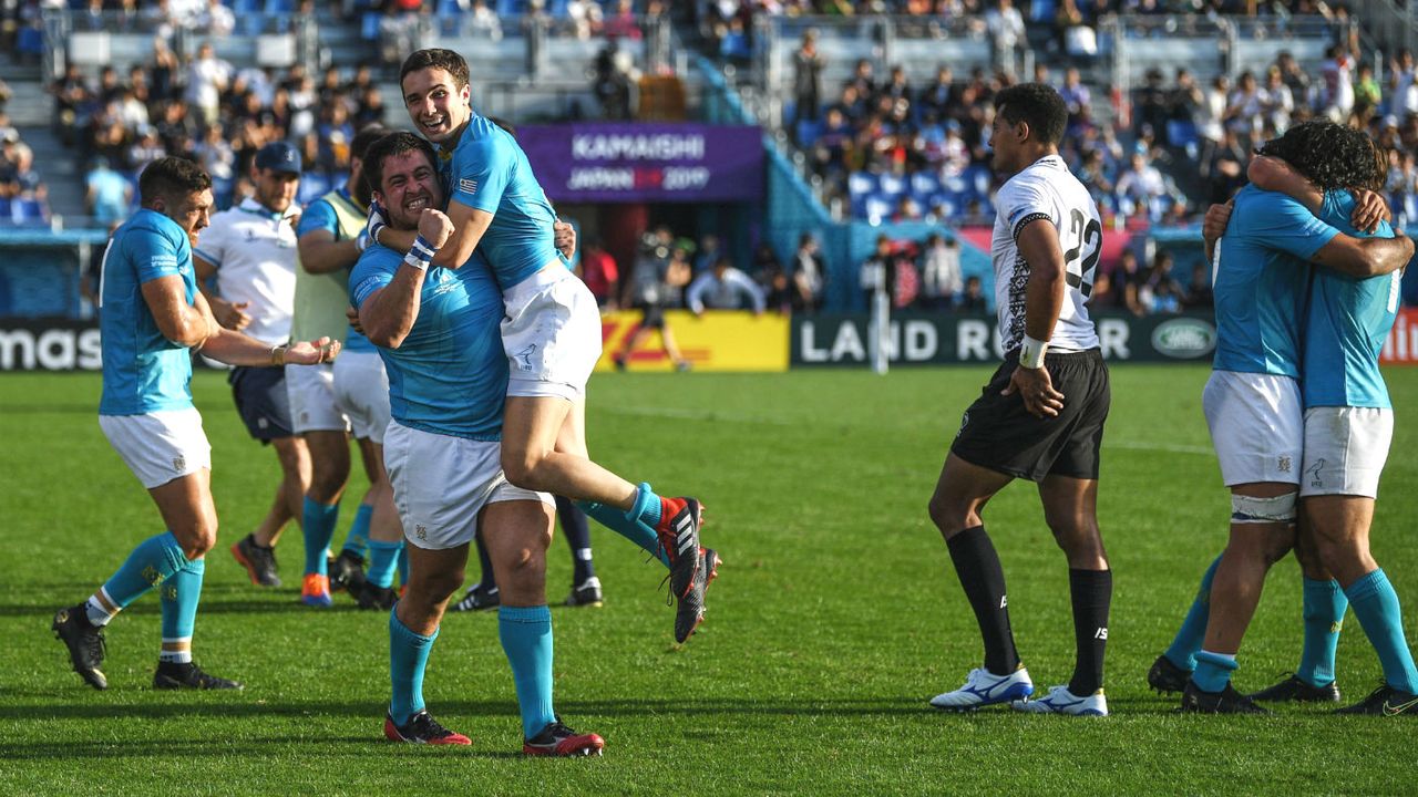 Uruguay players celebrate their victory over Fiji in Rugby World Cup pool D