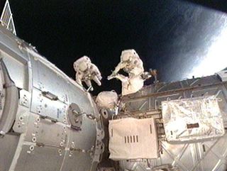 Spacewalkers Hook Up Plumbing For New Space Station Room