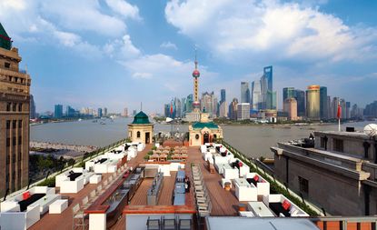 Rooftop terrace of hotel with multiple seating areas