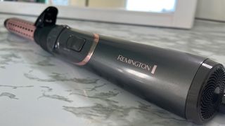 The Remington Curl and Straight Confidence Airstyler AS8606 with the curling tong attached