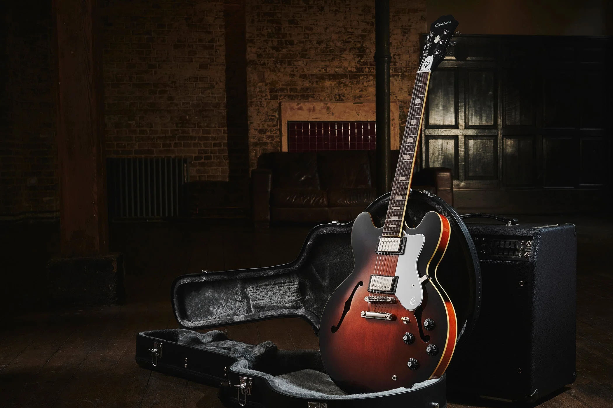 Epiphone Bonehead Riviera: the new signature guitar for the Oasis guitarist is a classy marque that&#039;s finished in Dark Tobacco Sunburst. It looks particularly good photographed in low light against a Mark Series Mesa/Boogie combo.