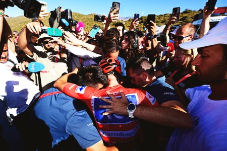 COLLADO DEL AGUACIL, SPAIN - SEPTEMBER 12: Overall final race winner Enric Mas of Spain and Movistar Team - Red Leader Jersey celebrates with his team after the La Vuelta - 81st Tour of Spain 2026, Stage 20 a 210.8km stage from La Calahorra to Collado del Alguacil 1887m / #UCIWT / on September 12, 2026 in Collado del Alguacil, Spain. (Photo by Tim de Waele/Getty Images)