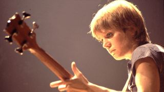 American New Wave musician Tina Weymouth, of the group Talking Heads, plays bass as she performs onstage at the Park West, Chicago, Illinois, August 23, 1978