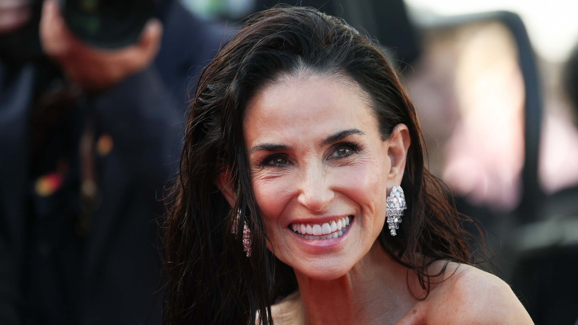 demi moore wears wet hair at a cannes film festival event
