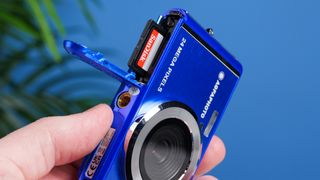 A blue AgfaPhoto Realishot DC5500 compact camera