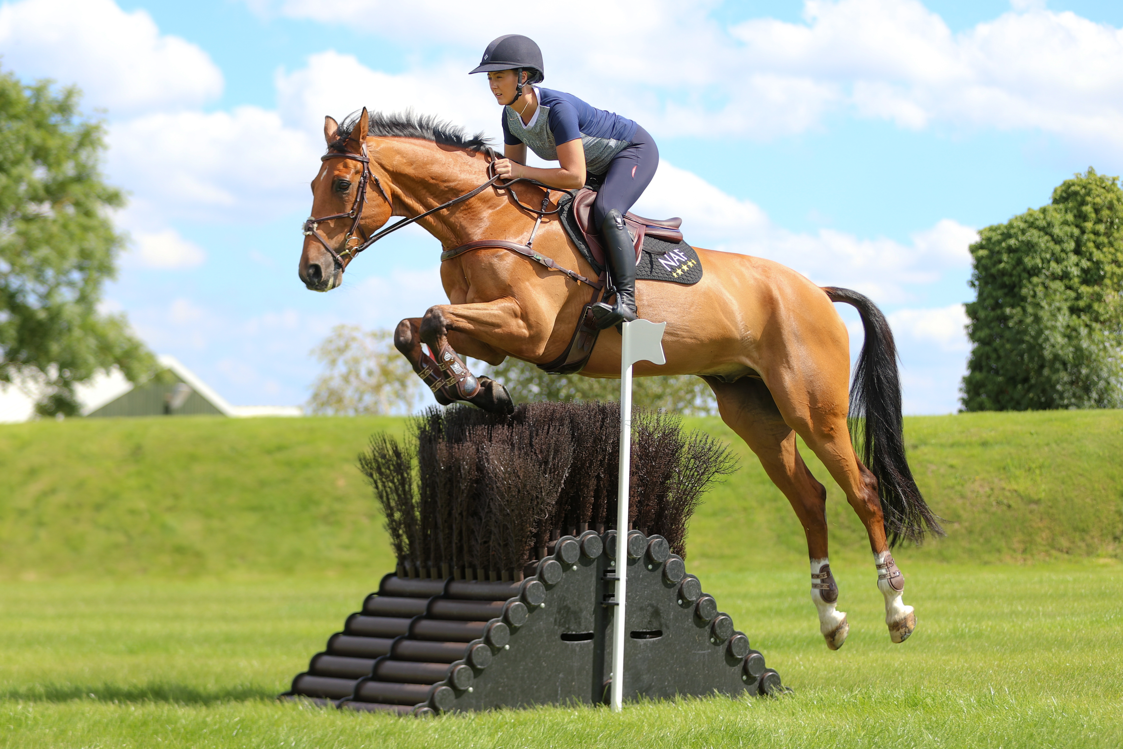 Yasmin Ingham jumping Rehy DJ at home in the Derby field.
