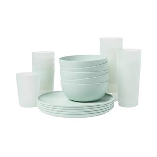 Mint green dishes and glasses stacked