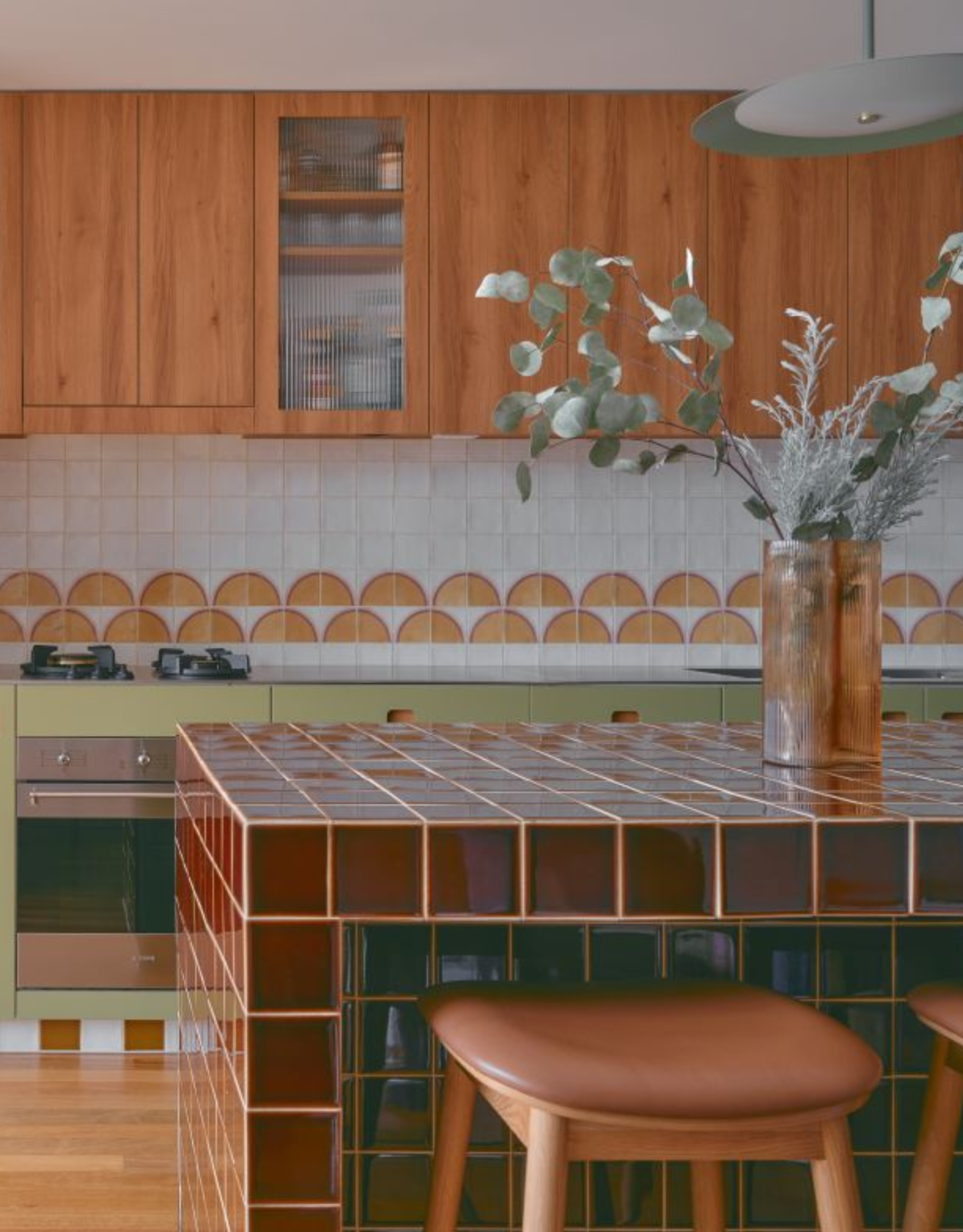 cool maroon tiled kitchen island in a retro style kitchen