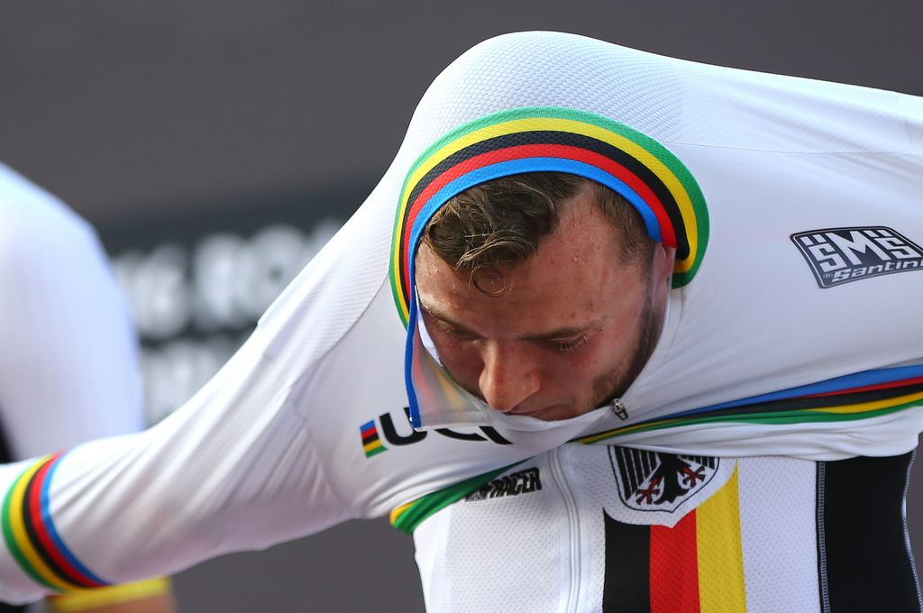 Marco Mathis (Germany) pulls on the rainbow jersey
