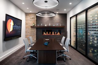 Fishtech standardized its conference room setup with Zoom Rooms, Crestron Flex hardware, and displays from Sharp, LG, and Christie.