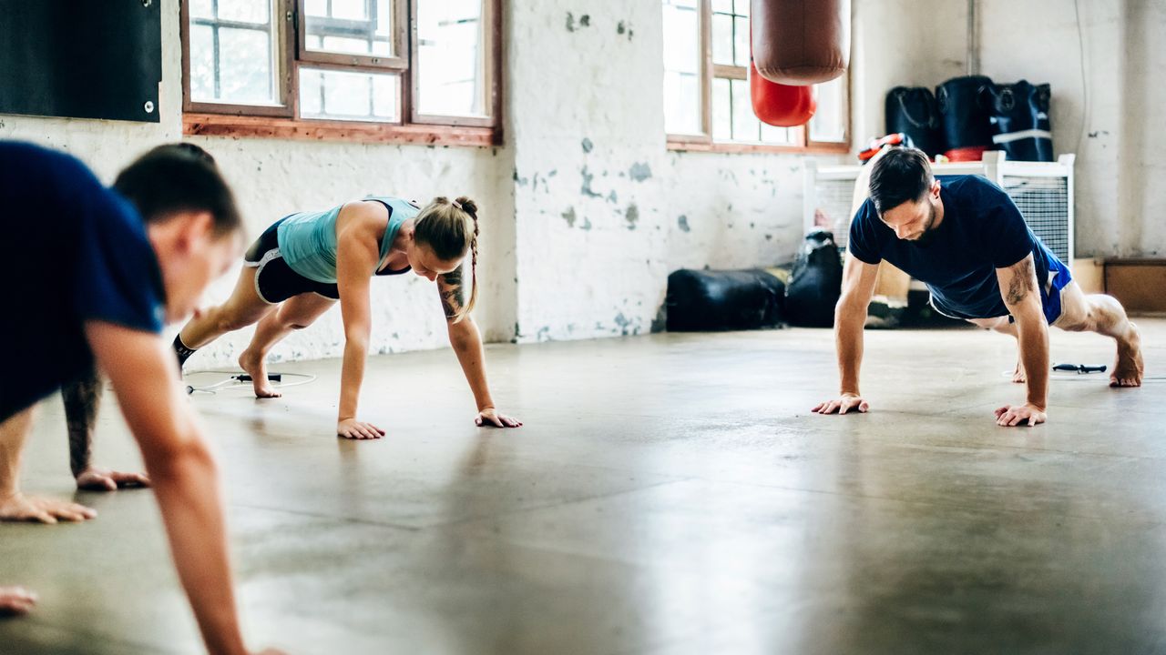 A group tries a push up challenge such as Bring Sally Up