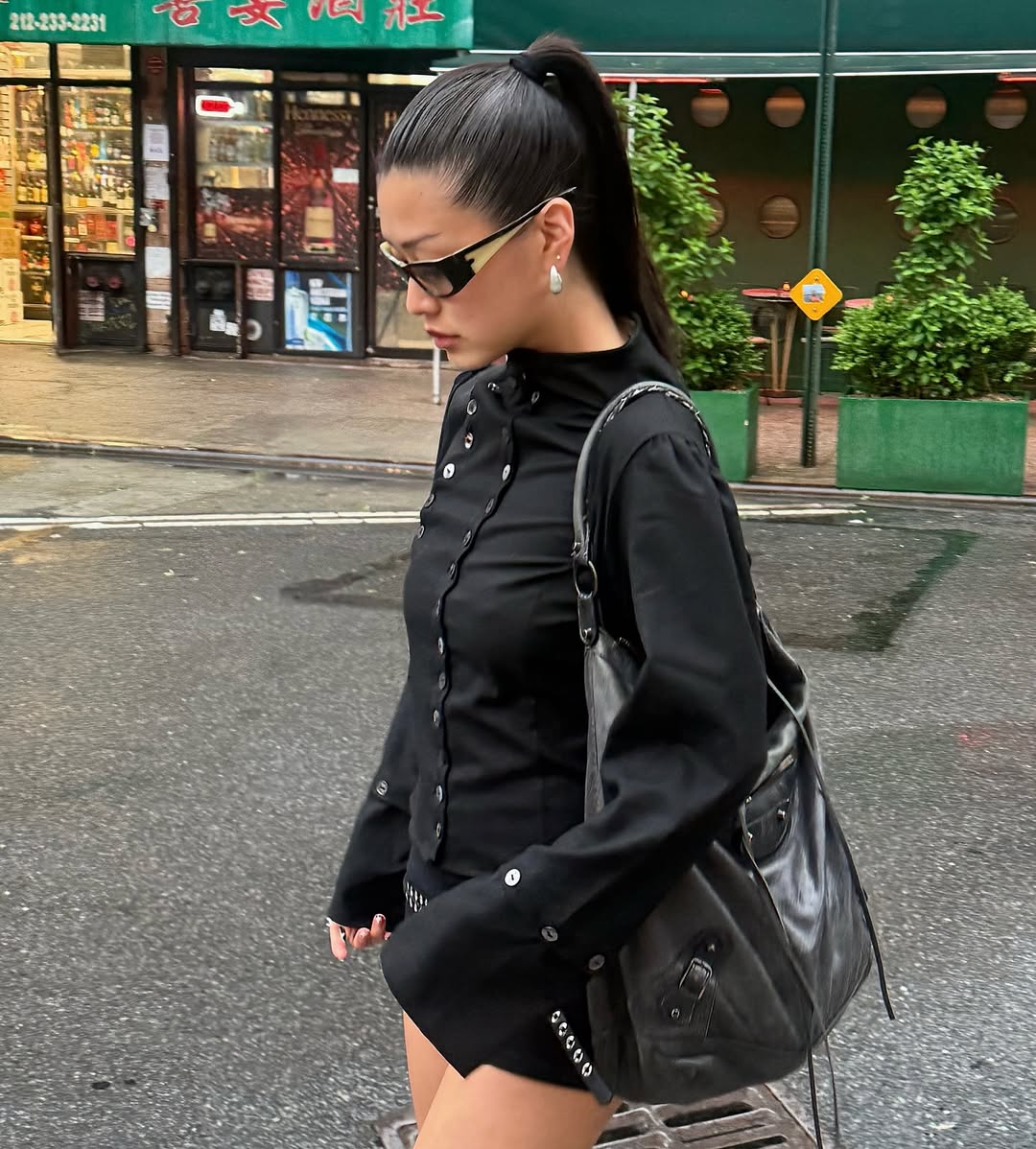 Carolyn Chang wearing an all black outfit with sunglasses.