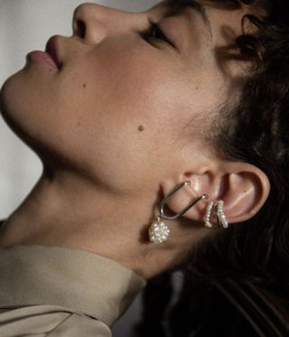 woman wearing pearl earrings