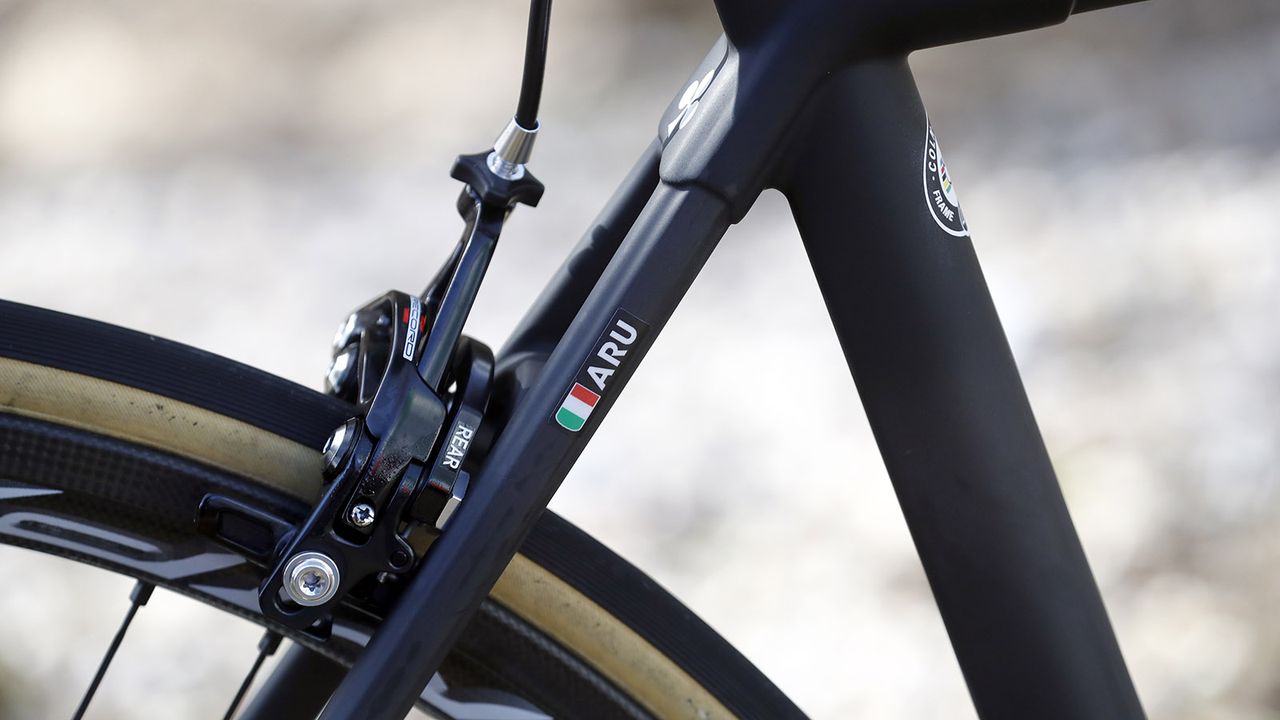 Each UAE Team Emirates rider has their name and nationality on their bikes