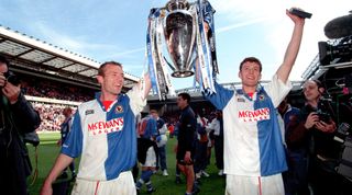 Blackburn Rovers' Alan Shearer and Chris Sutton celebrate with the FA Carling Premiership trophy