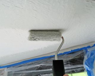 Painting a textured ceiling with a roller