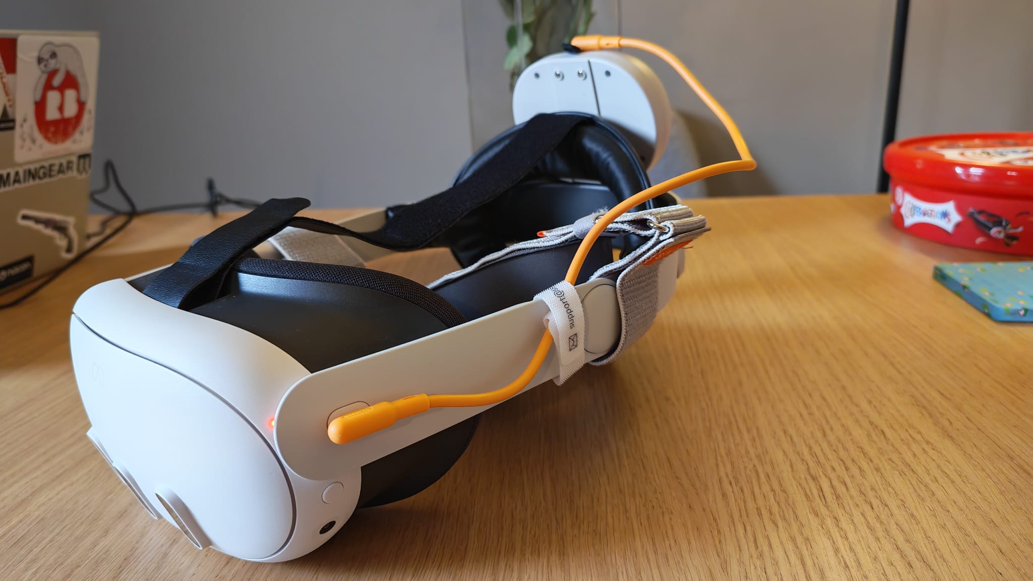 The orange cable for the Syntech Elite Head Strap for Quest 3