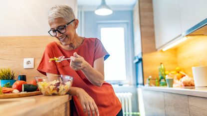 Older woman eating the best eye health foods