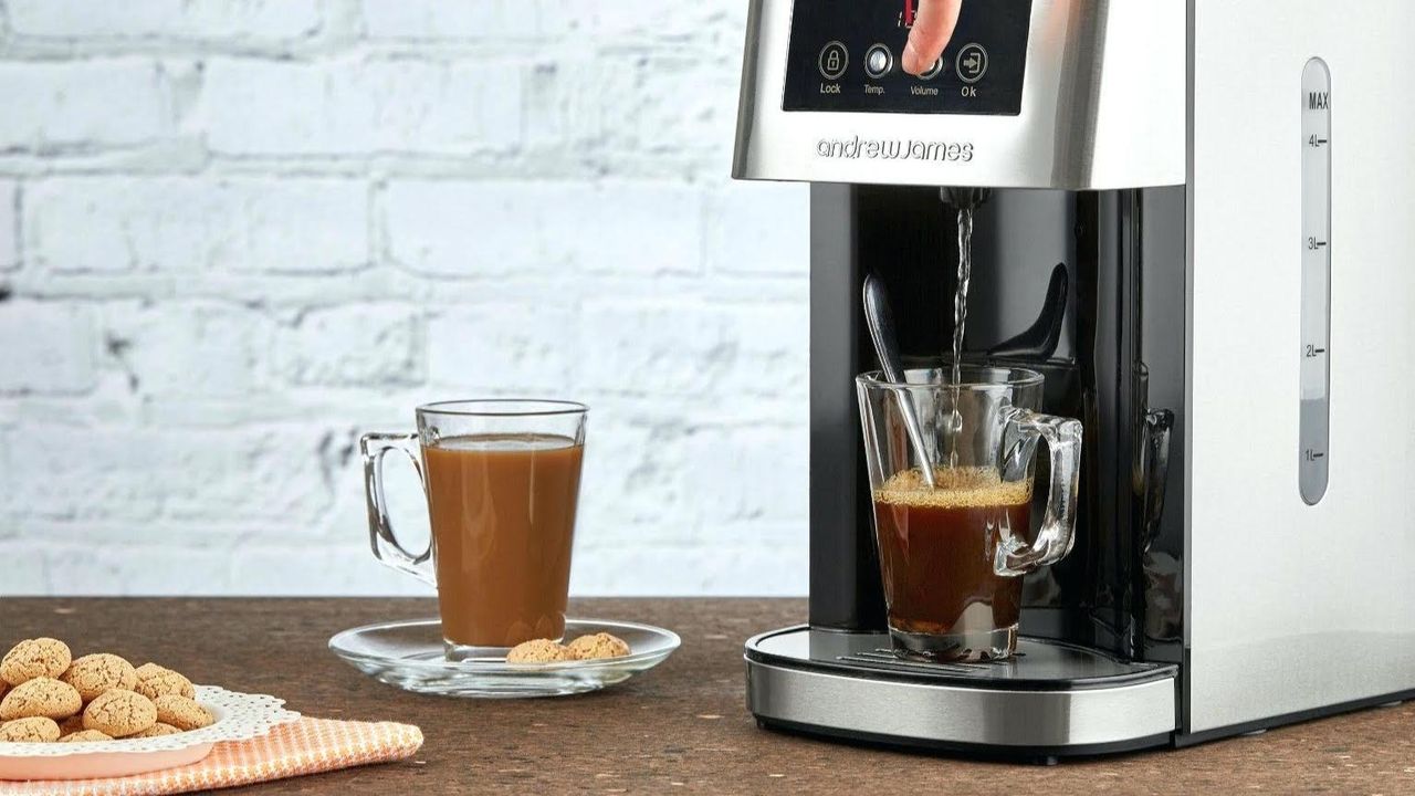 one of the best hot water dispensers being used in a kitchen to make coffee with a white brick wall in the background