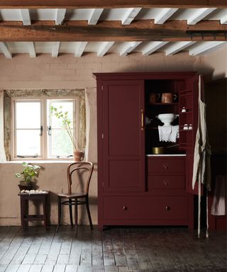 dark red butlers pantry freestanding by devol kitchens