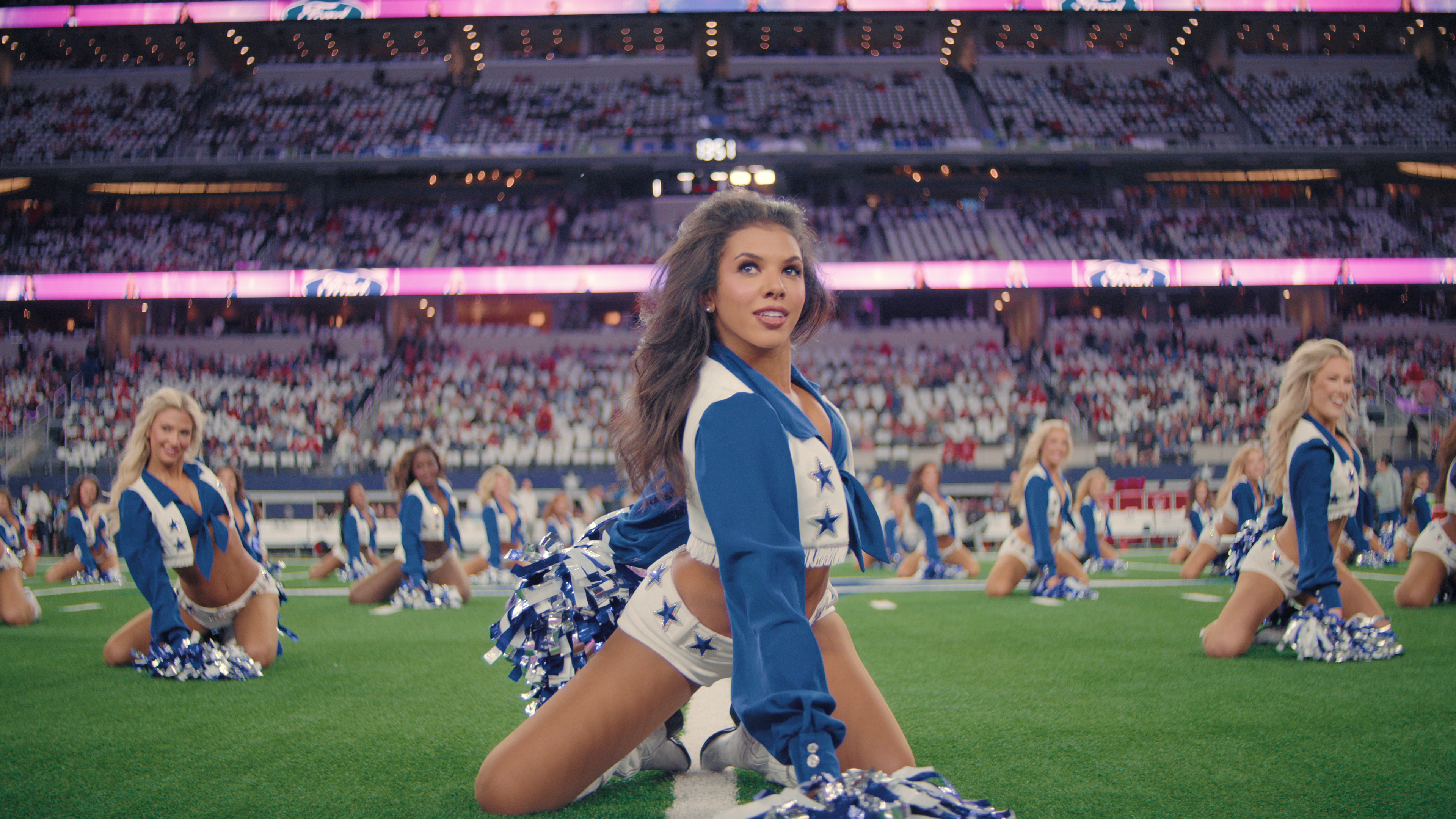 chandi performing in the center of a formation in america's sweethearts dcc season 2