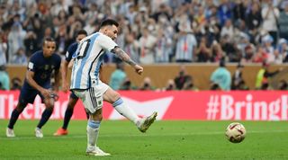 Lionel Messi puts Argentina ahead from the penalty spot against France in the 2022 World Cup final.