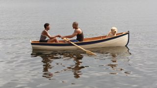 Couple in boat with dog