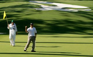 Chris DiMarco celebrates a putt on the tenth green during the final round of The Masters at the Augusta National Golf Club on April 10, 2005