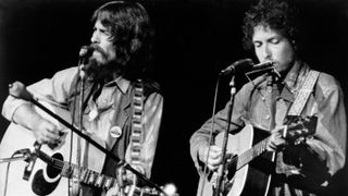 George Harrison and Bob Dylan perform onstage at the Concert for Bangladesh which was held at Madison Square Garden on August 1, 1971 in New York City, New York. 