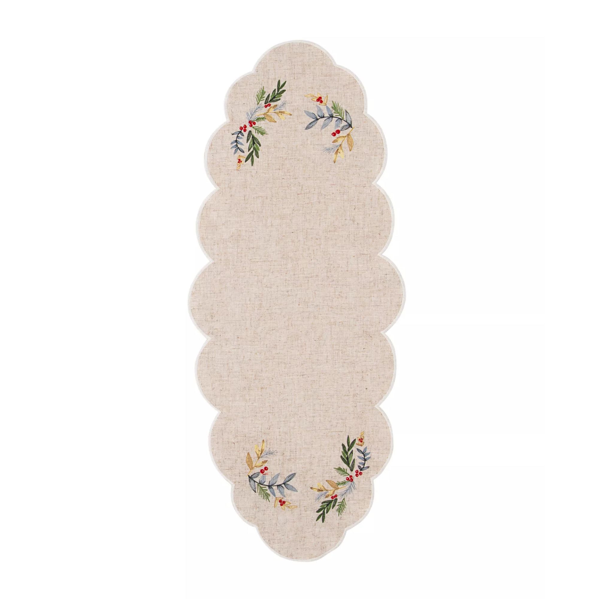Scalloped linen centerpiece with holly motif