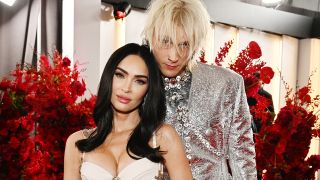 Megan Fox and Machine Gun Kelly in silver and white on the red carpet before their breakup. 