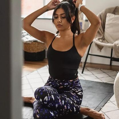 A woman trying M&S Go Move leggings