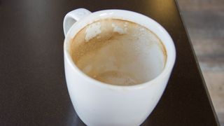 Coffee stains in white mug